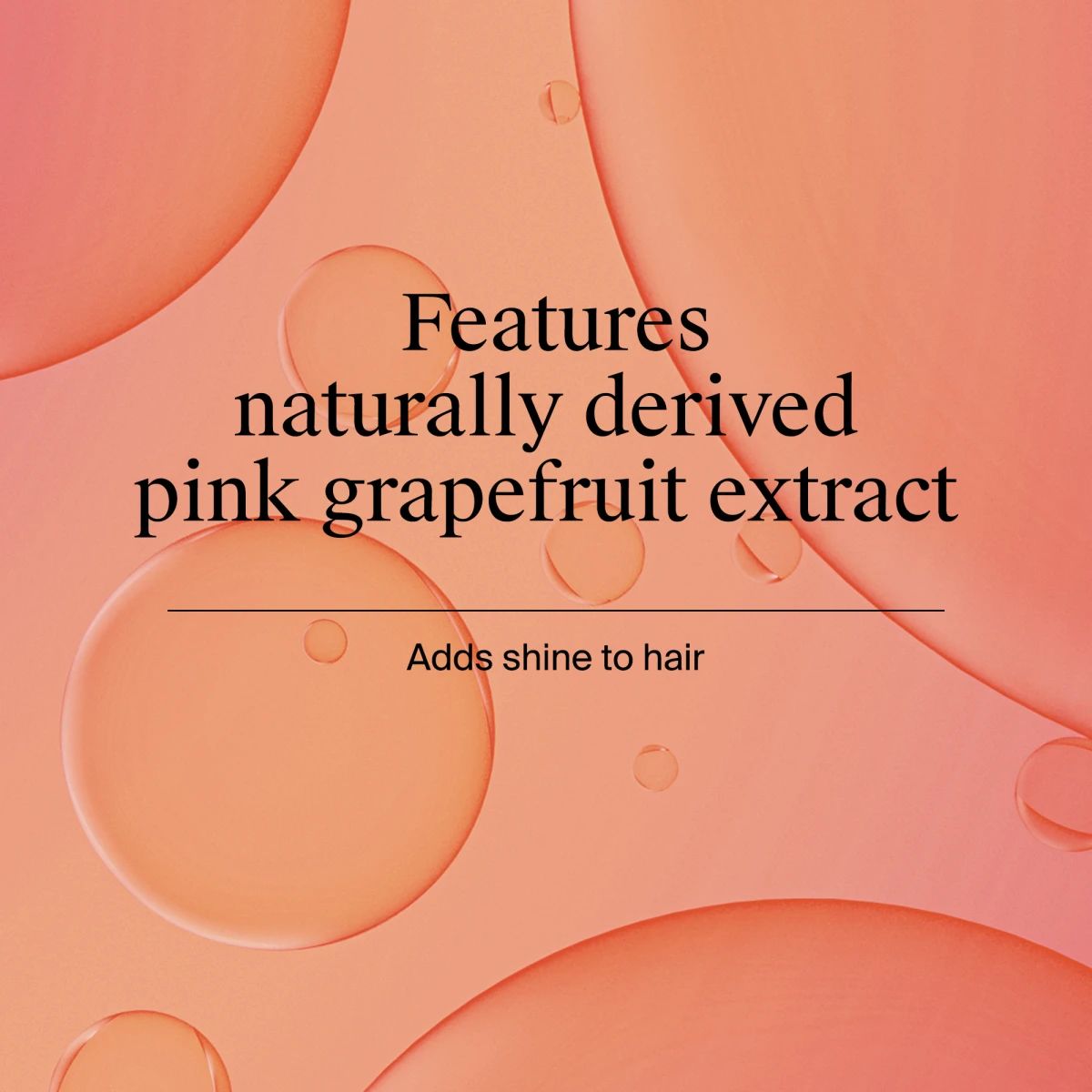Text that reads “Features naturally derived pink grapefruit extract” and “Adds shine to hair,” over a peach background with abstract liquid bubbles.