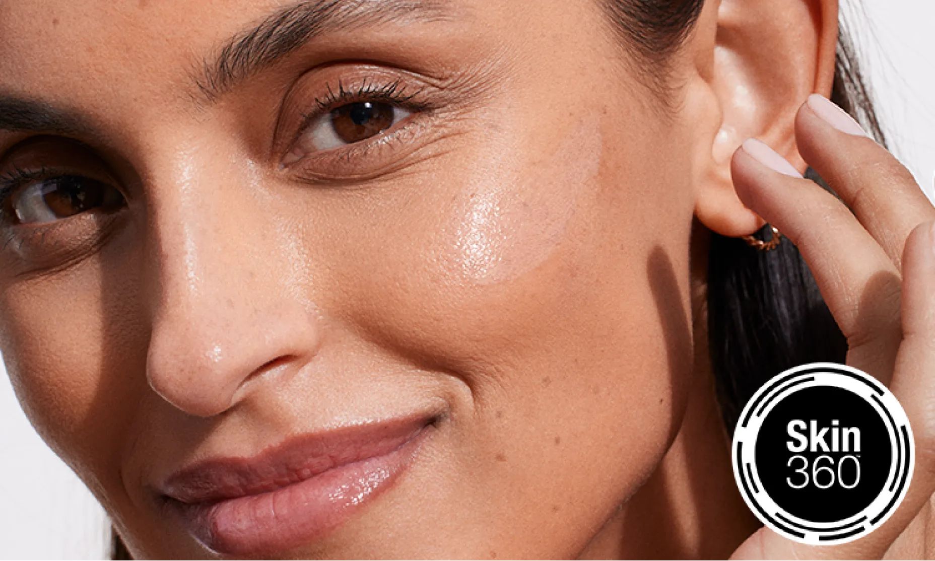 woman smiling after using Neutrogena® Skin360™ to find tailored recommendations