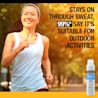 Woman jogging outdoors showing thumbs up with Neutrogena® Sport SPF 70, 99% suitable for activities