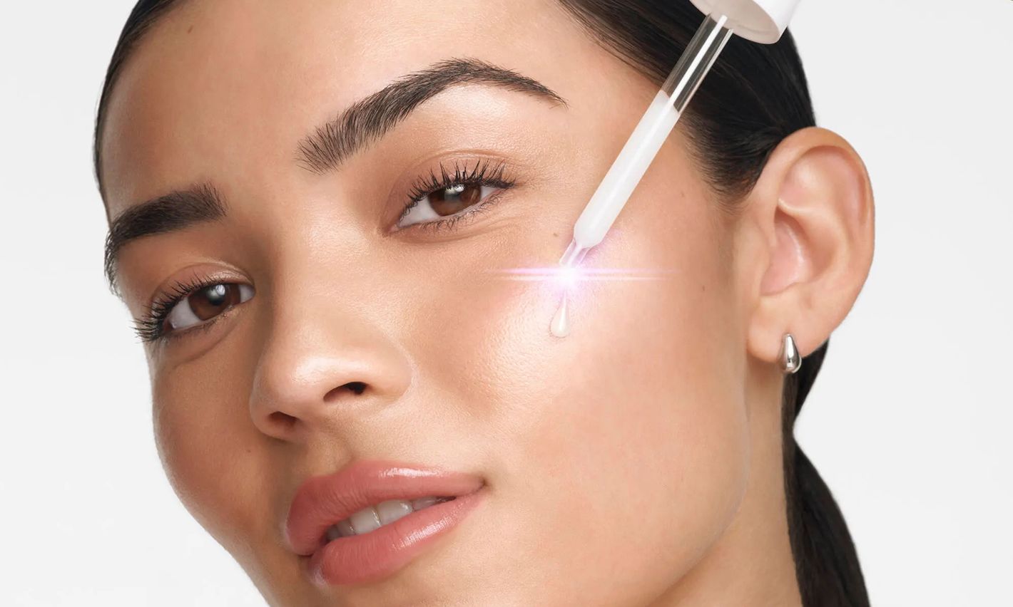 Sample Image Women applying Neutrogena® Collagen Bank® Laser Perfecting Serum to face with a dropper