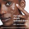 Young woman applying Neutrogena Hydro Boost Gel Cream on her left cheek for deep hydration