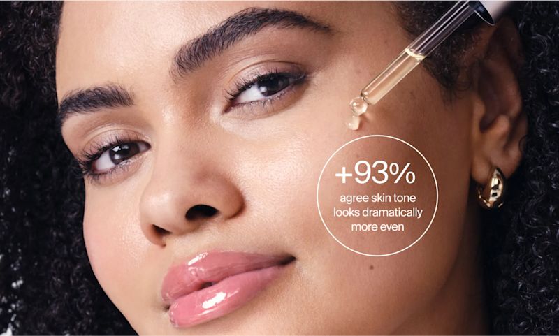 Woman applying Neutrogena® Collagen Bank 15% Vitamin C Glow Serum. +93% agree skin tone looks dramatically more even