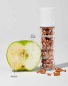 A bottle of NEUTROGENA® Rapid Tone Repair 20% Vitamin C Serum Capsules, 30ct and an experiment of vitamin C serum on an apple