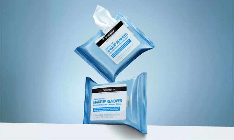 2 Wipe packages. One with a wipe removed from the packaging