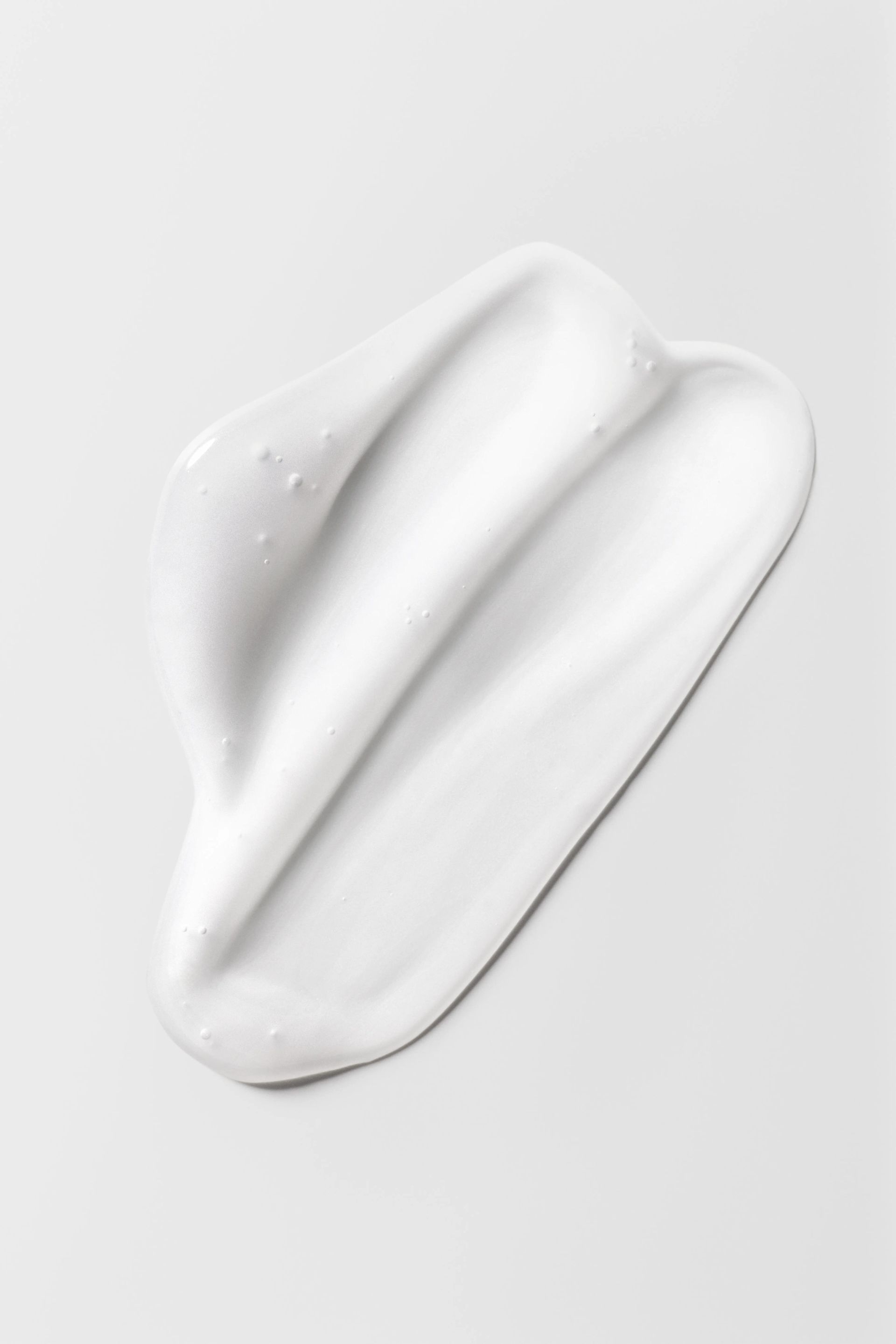 Neutrogena_Acne_Weekly_ExfoliatingOvernightPeel_Texture_Still_Background_TIF.WEBP