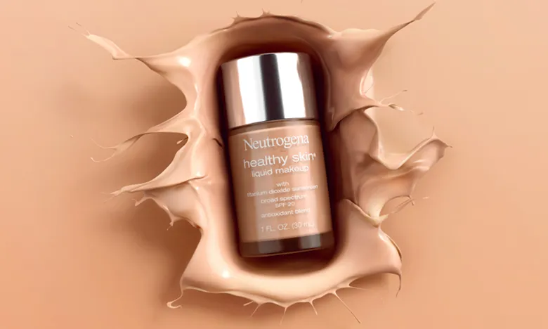 Bottle of Neutrogena® Healthy Skin Liquid Makeup Broad Spectrum SPF 20 Splashing into a pool of liquid makeup