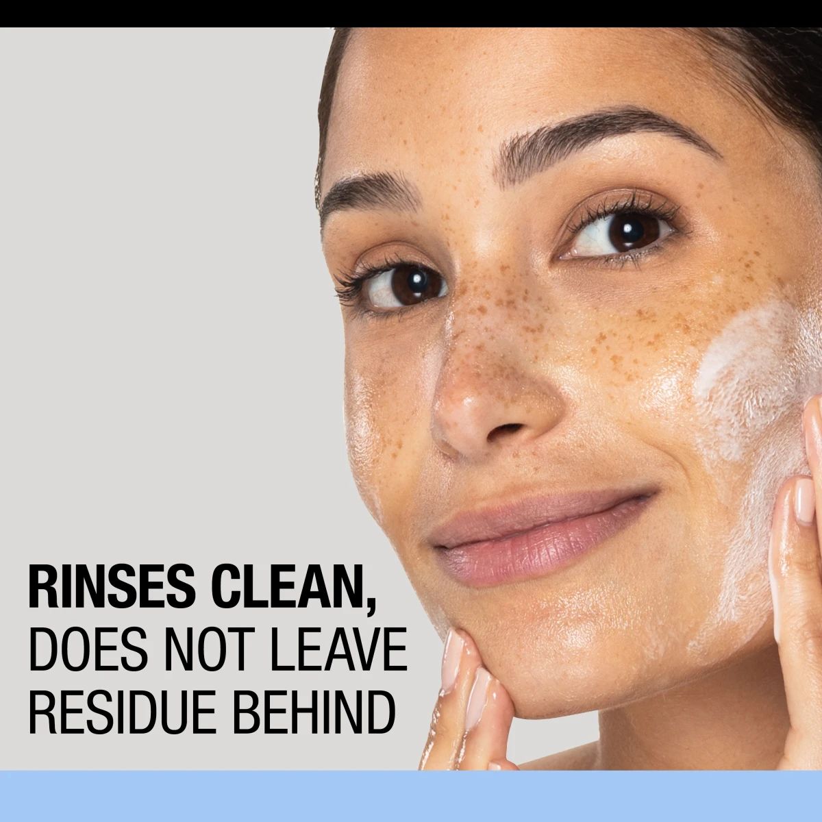 Woman with foam on face, Neutrogena® cleanser rinses clean without leaving residue behind