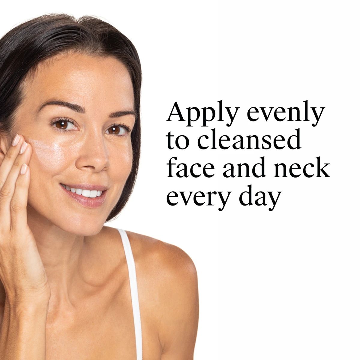 Smiling woman applying cream with instructions to apply evenly to cleansed face and neck daily.