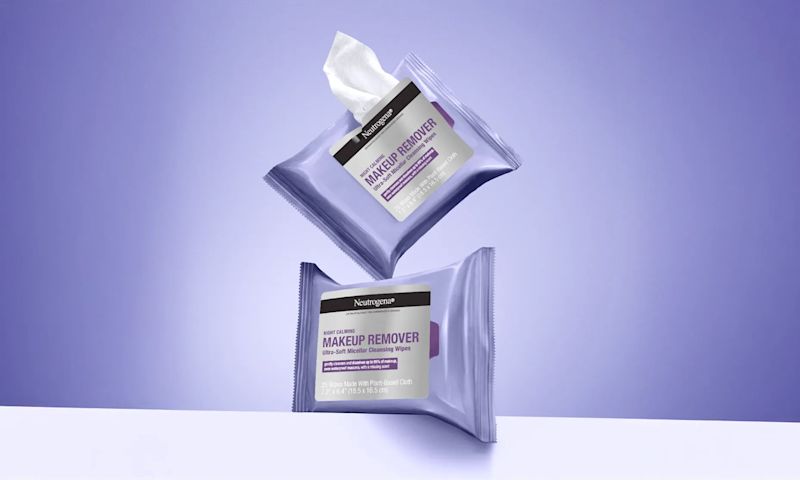 2 Wipe packages. One with a wipe removed from the packaging