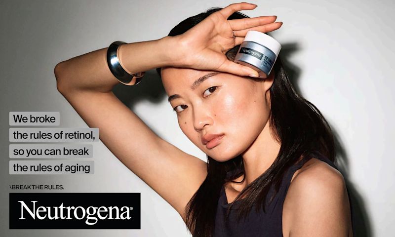 Woman holding a jar of Neutrogena® Rapid Wrinkle Repair® Retinol Regenerating Cream Fragrance Free and the text "We broke the rules of retinol so you can break the rules of aging"