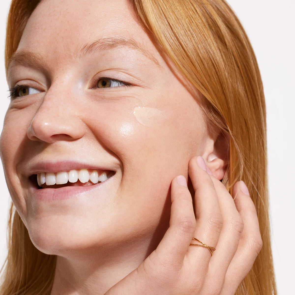 Glowing dewy complexion with smooth, even skin after applying tinted mineral sunscreen