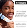 woman smiling holding Neutrogena Ultra Sheer Invisible Gel Face Sunscreen Broad Spectrum SPF 40 for invisible sun protection, premium feel