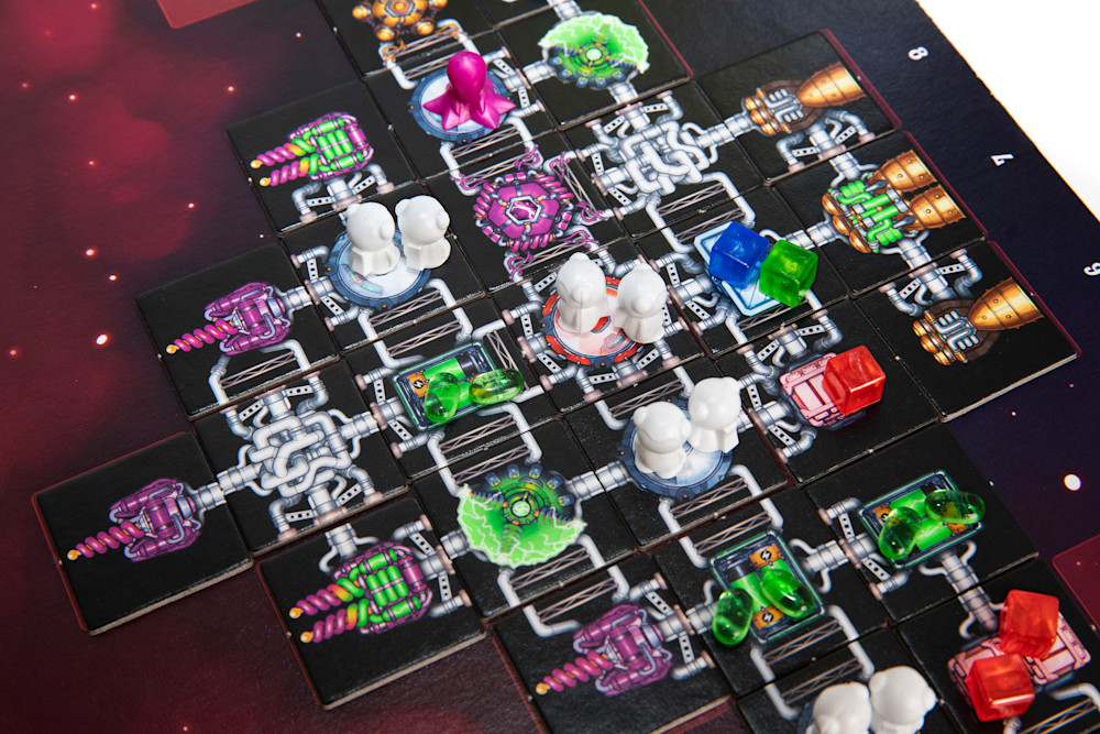 In Galaxy Truckers, you build a spaceship by placing different types of tiles on a mat.