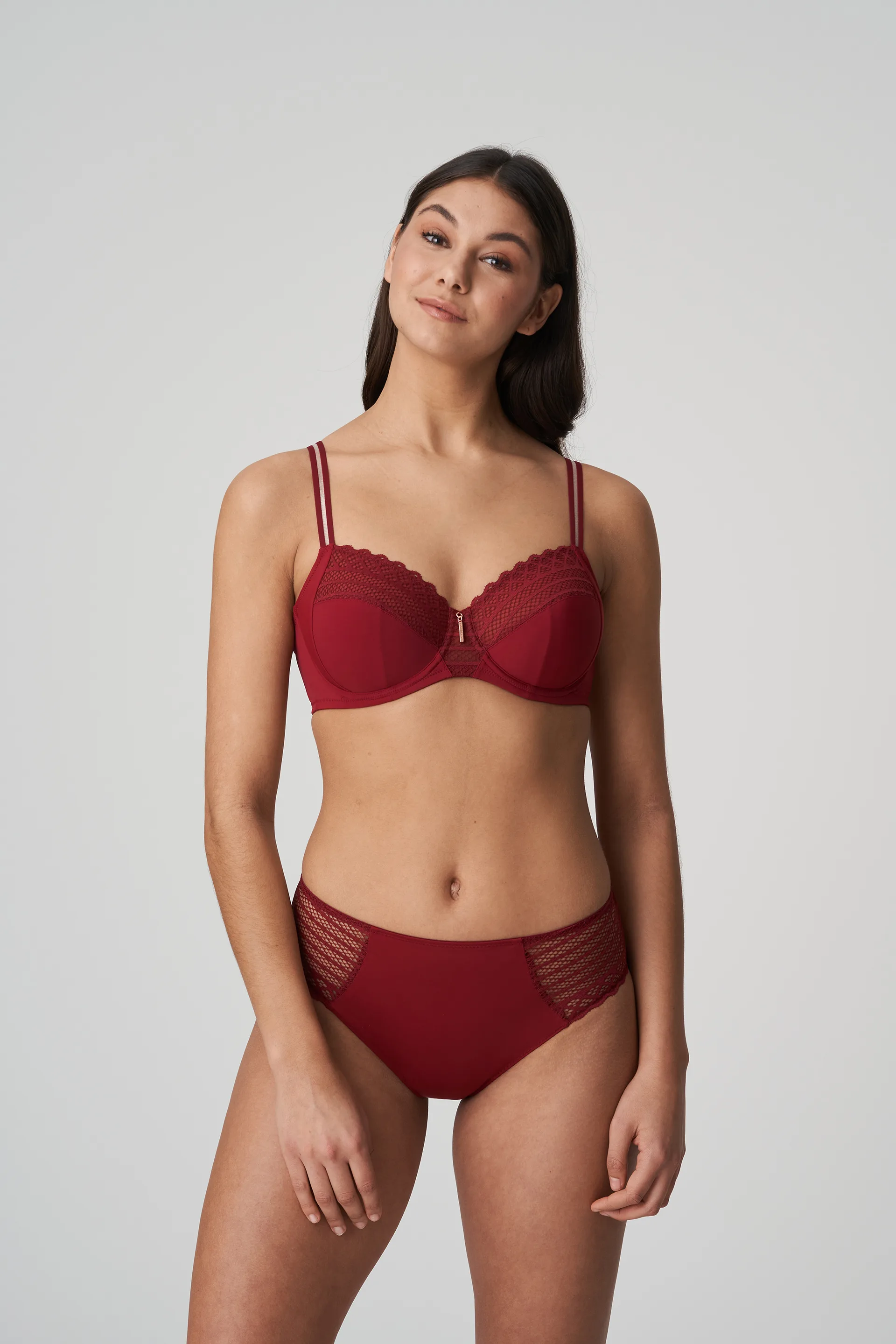 Photo of Lacy Bra on Red Silky Fabric