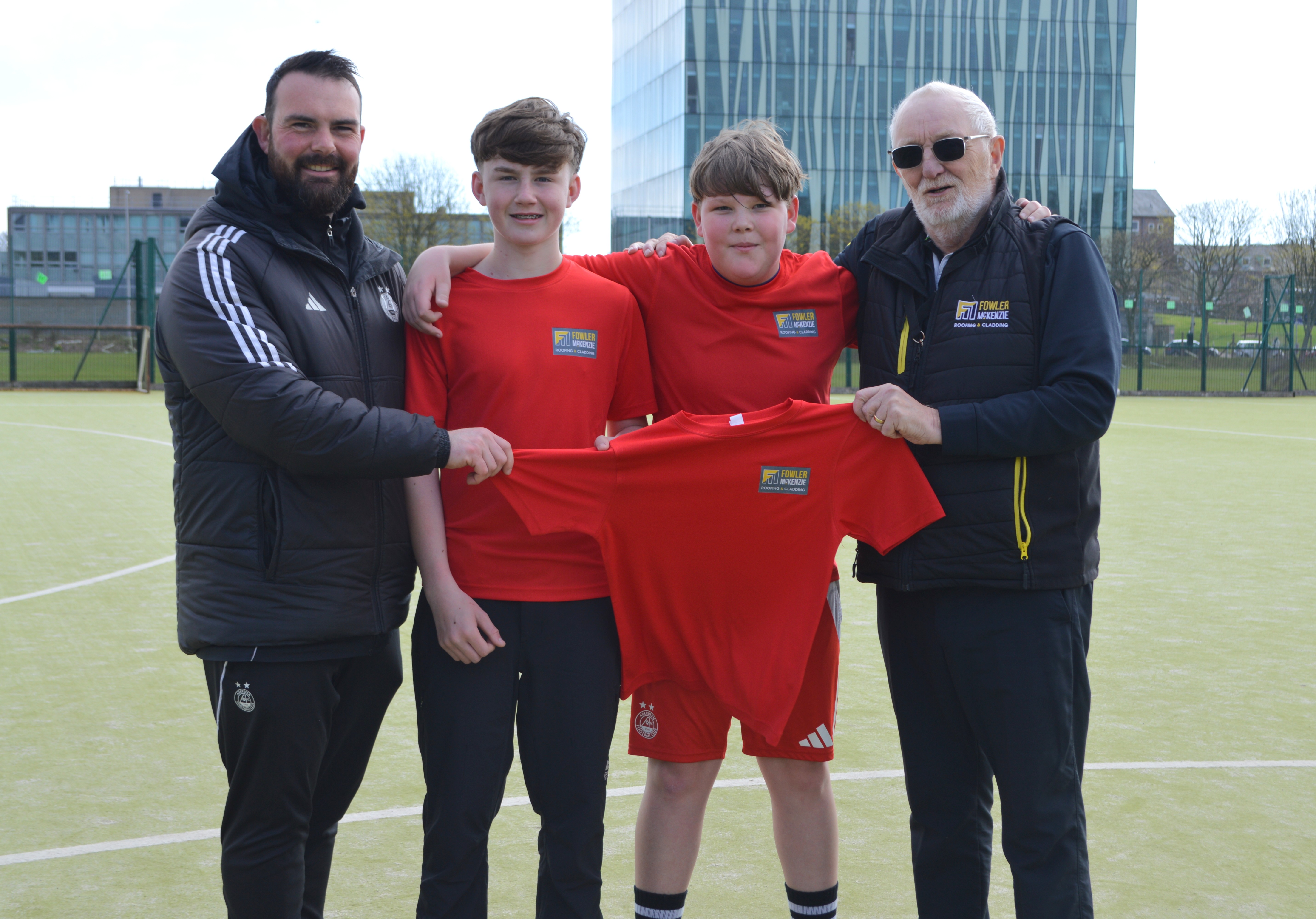 Phil McKenzie, David Clark and pupils from St Machar School of Football programme. 
