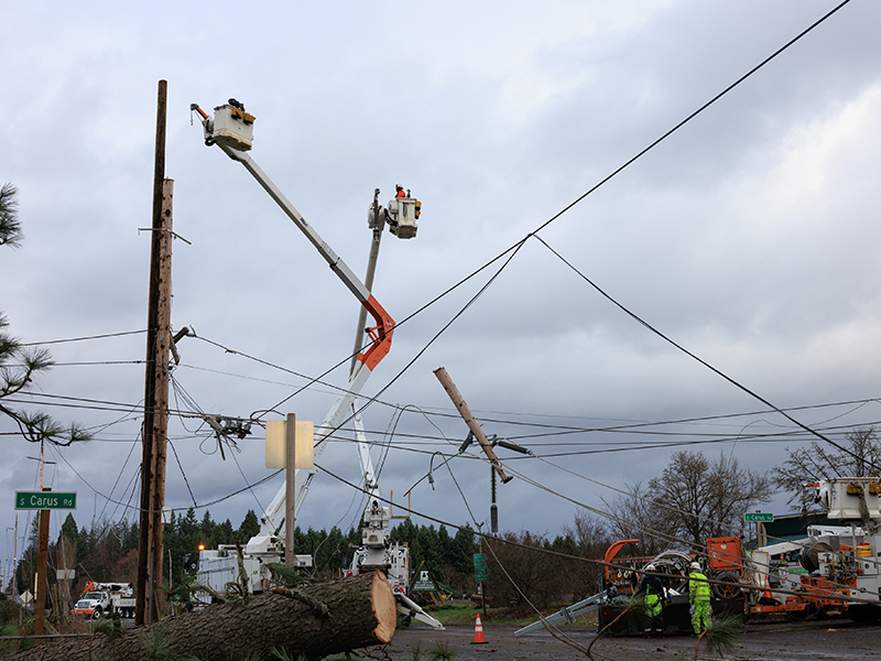 PGE line crews work to restore power near Oregon City, Ore., following an overnight wind event on Dec. 17, 2025 that left thousands of customers without power.