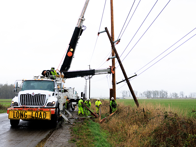 PGE line crews work to restore power near Salem, Ore., following an overnight wind event on Dec. 17, 2025 that left thousands of customers without power.