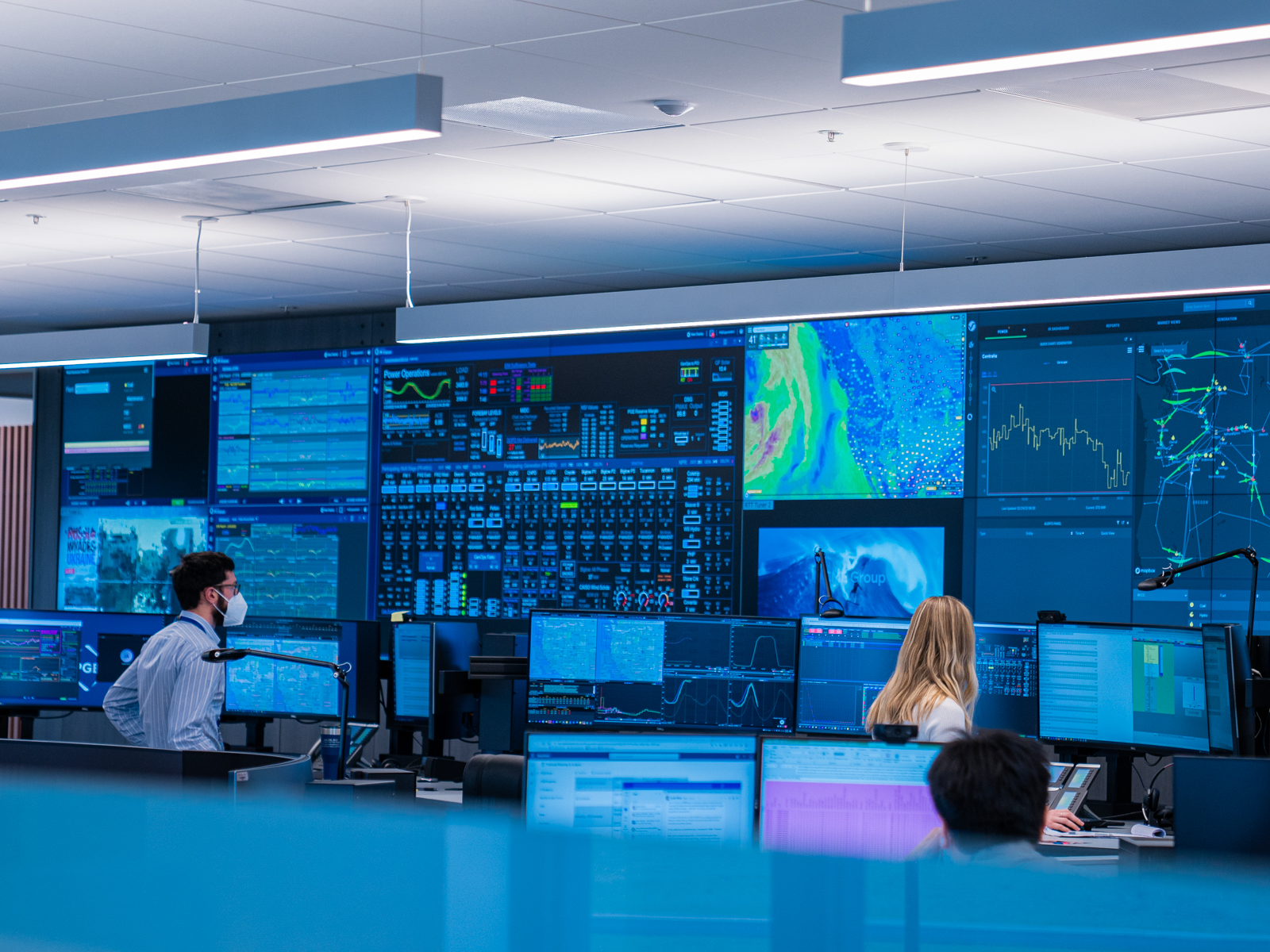 People monitoring screens at the Integrated operations center IOC