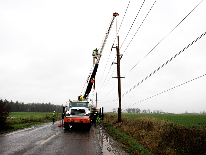 PGE line crews work to restore power near Salem, Ore., following an overnight wind event on Dec. 17, 2025 that left thousands of customers without power.