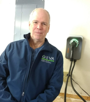Gary Exner with his EV charger in his garage