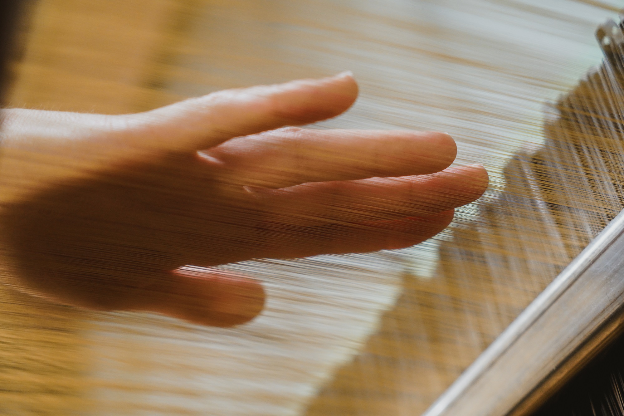 hand touching threads