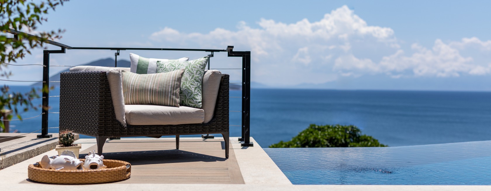 Lounge chairs with cushions by pool