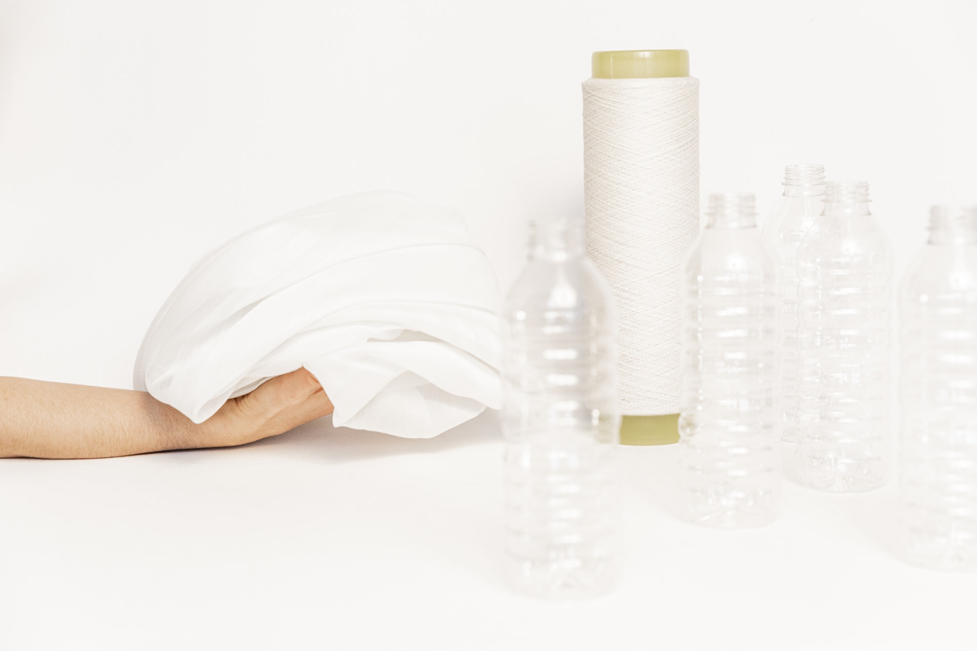 plastic bottles, thread and white cloth
