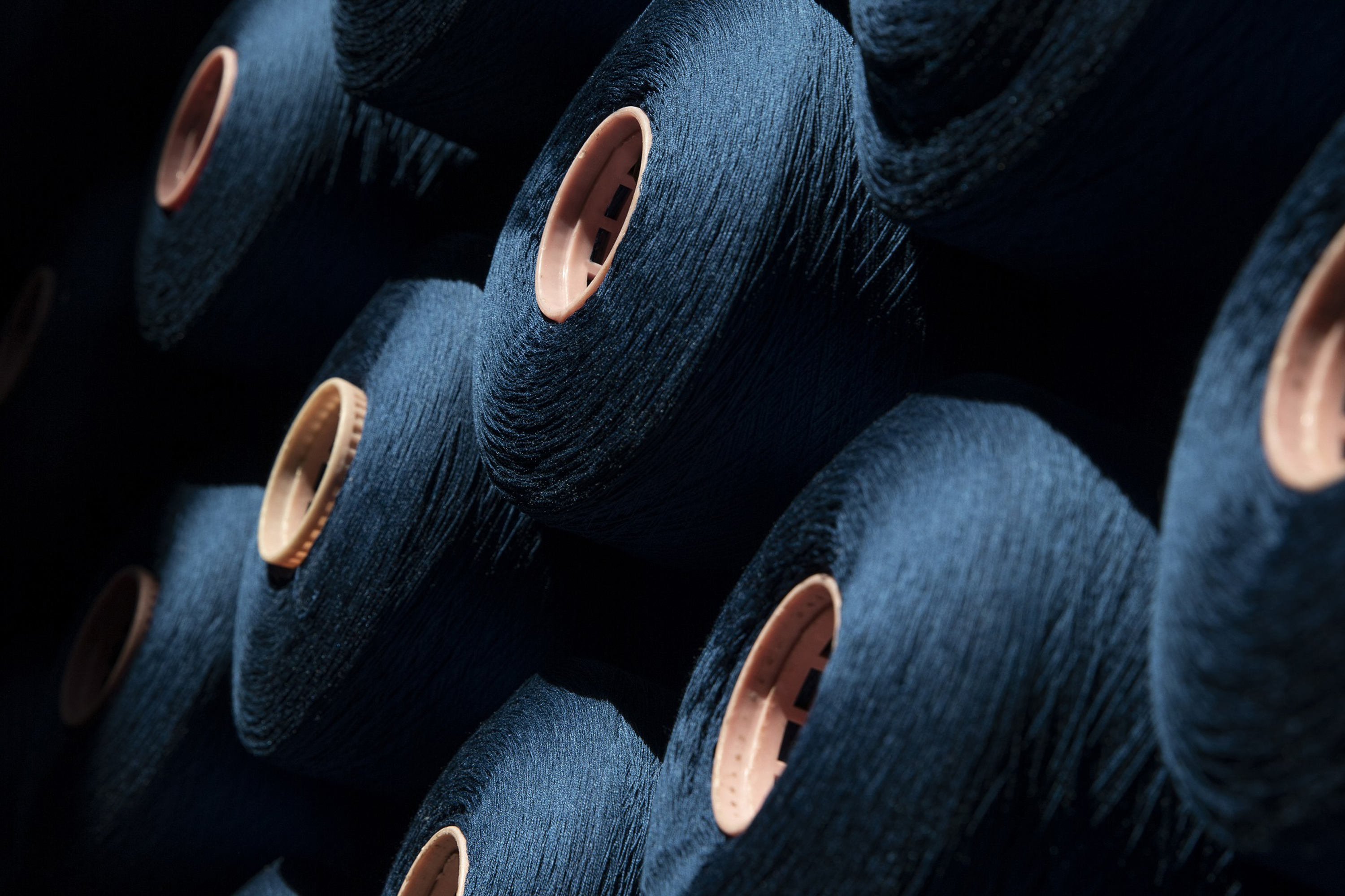 dark blue spools of thread