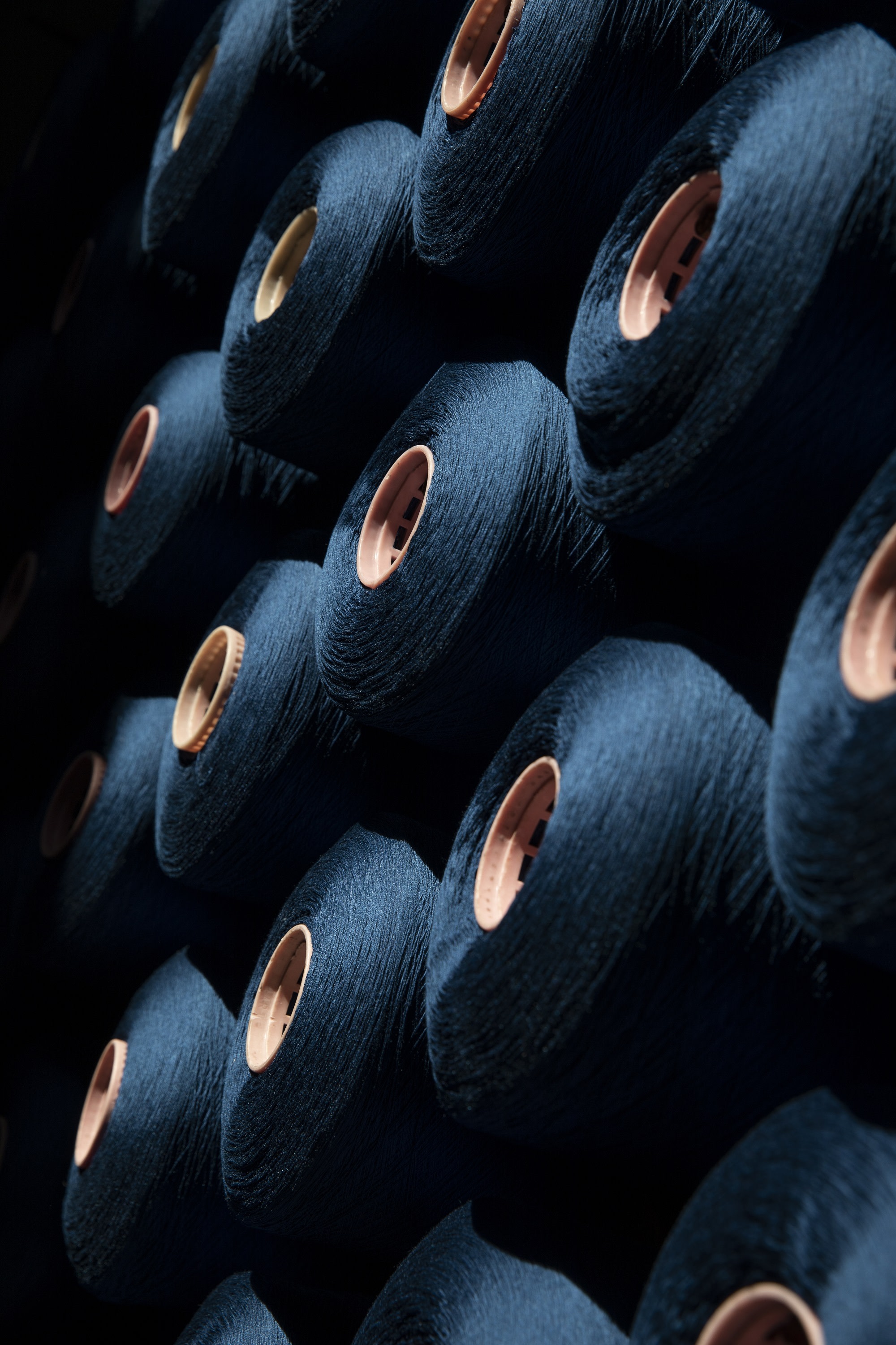 dark blue spools of thread