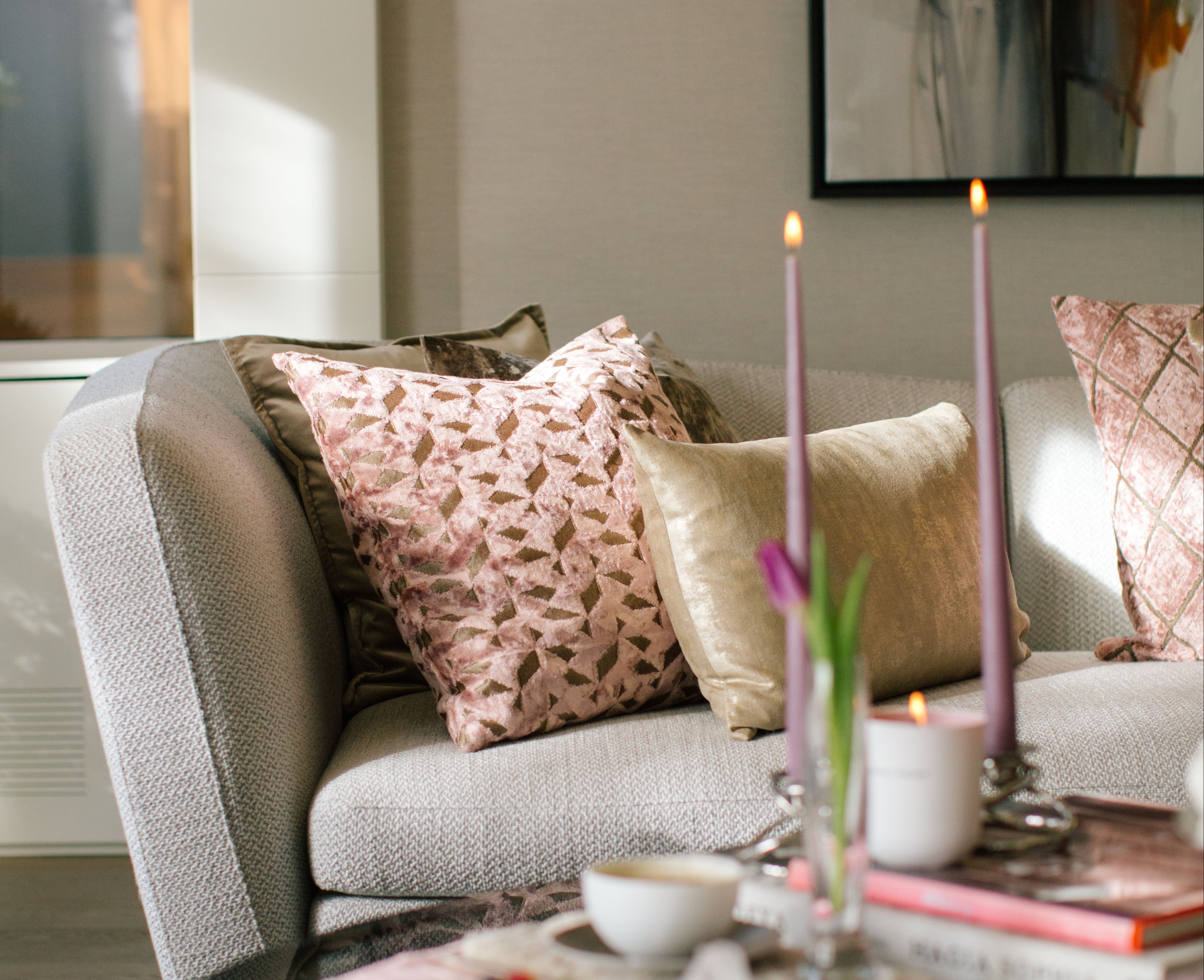 earth toned cushions on couch