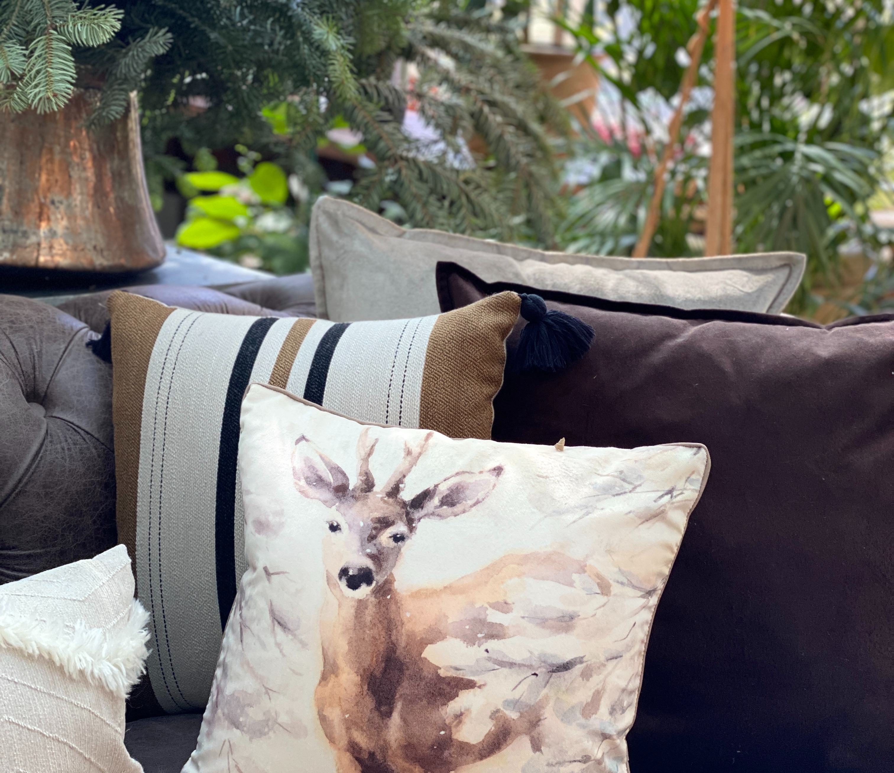 emerald cushions on sofa