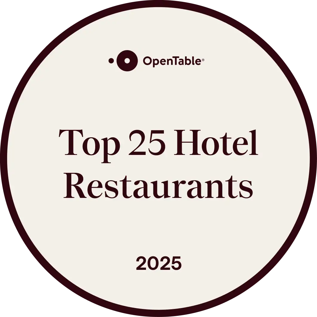 A circular badge with the OpenTable logo at the top and the text "Top 25 Hotel Restaurants 2025" in the center.