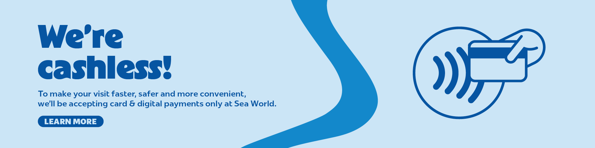 Blue banner with text: “We’re cashless! To make your visit faster, safer and more convenient, we’ll be accepting card &amp; digital payments only at Sea World.” Includes a hand holding a card with a contactless symbol.