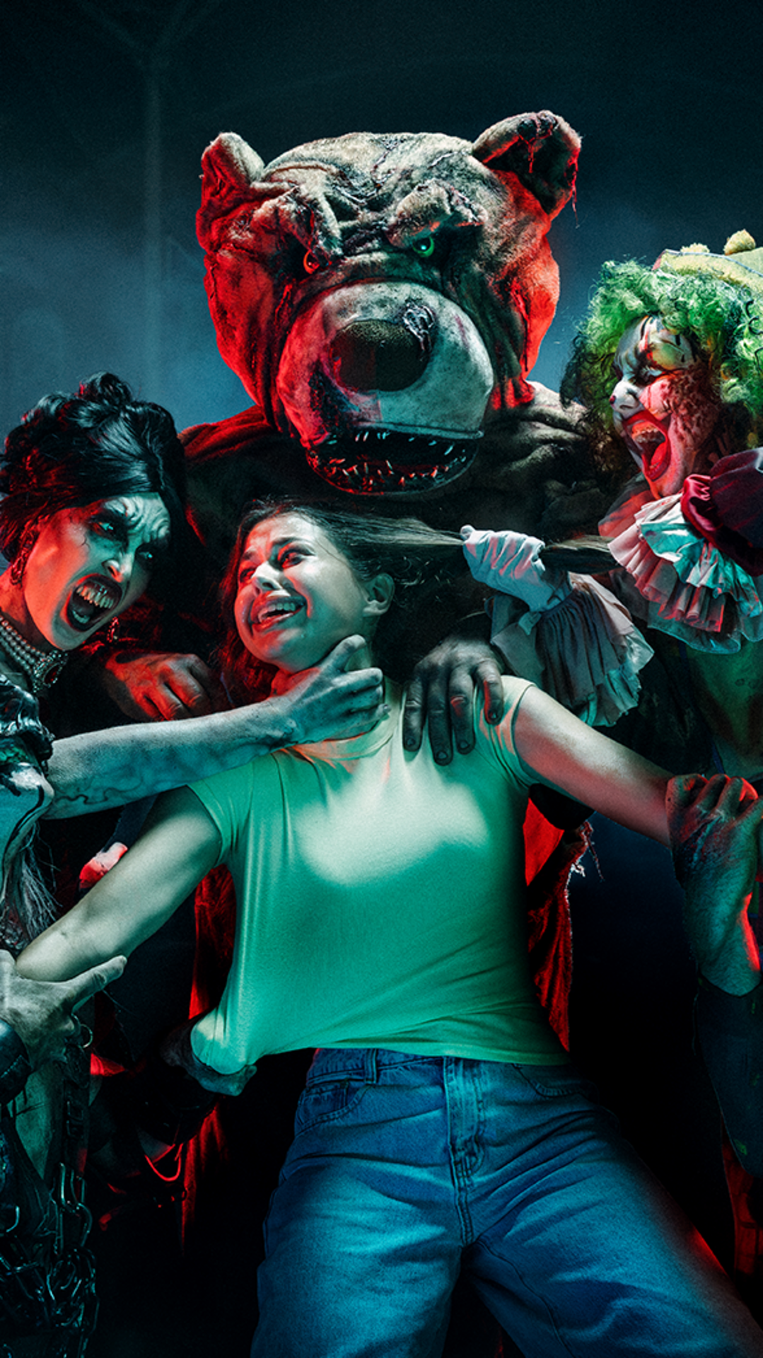 A terrified woman is grabbed by scary clowns and a person in a menacing bear costume, all lit with dramatic red and green lighting.