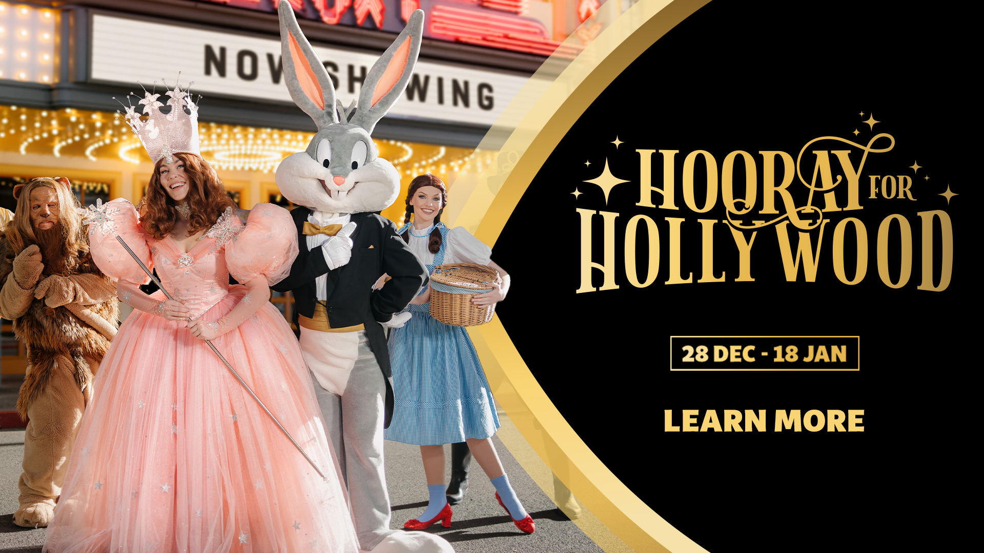 Bugs Bunny dressed in a tuxedo stands with people costumed as the Cowardly Lion, Glinda the Good Witch, and Dorothy in front of a theater marquee. Text reads "Hooray for Hollywood, 28 Dec - 18 Jan, Learn More.