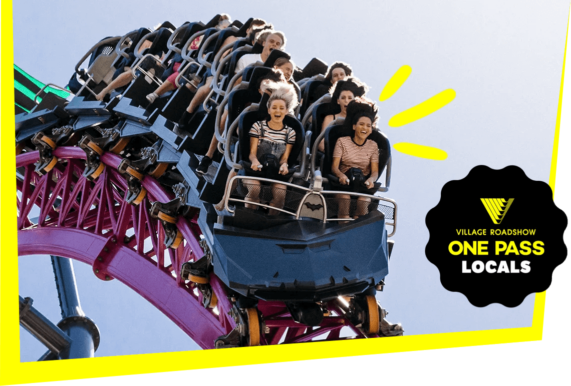Thrill-seekers riding a high-speed roller coaster on pink tracks at a Village Roadshow theme park, promoted with the One Pass Locals deal.
