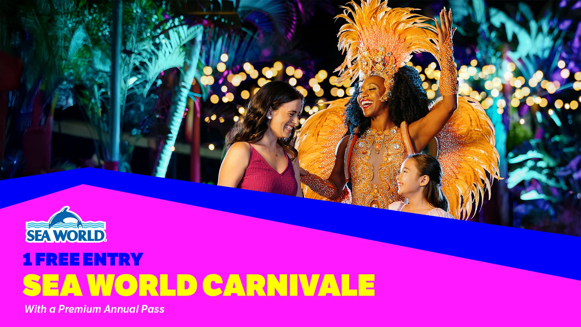 Two women and a young girl smile and interact with a carnival performer in a colorful feathered costume at night, with bright lights and palm trees in the background. Text promotes "Sea World Carnivale" and free entry with a premium pass.