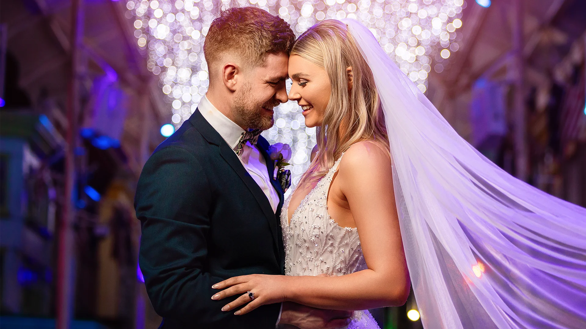 A newly-married couple riding in style in the Warner Bros. limousine on Main Street at Warner Bros. Movie World, enjoying a magical and memorable moment together