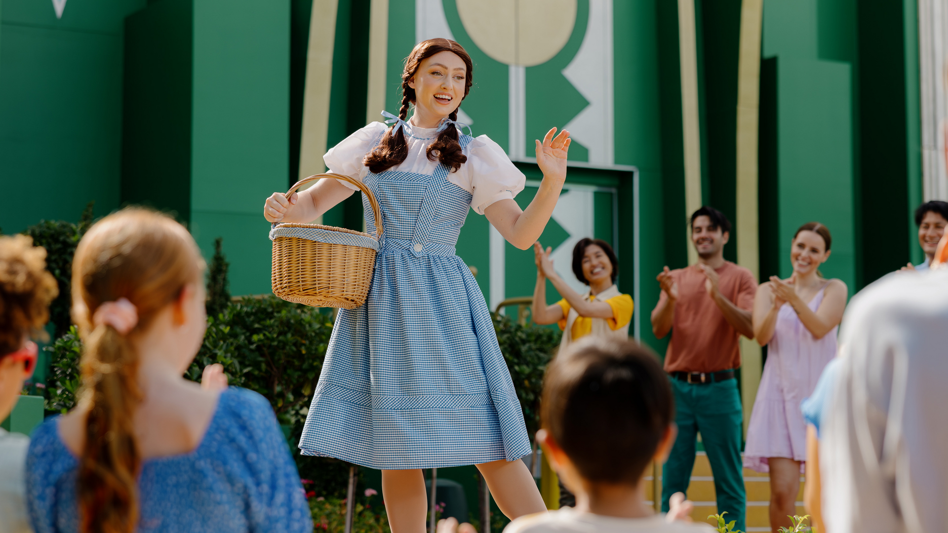 Wizard of Oz character Dorothy singing to the audience at Warner Bros. Movie World.