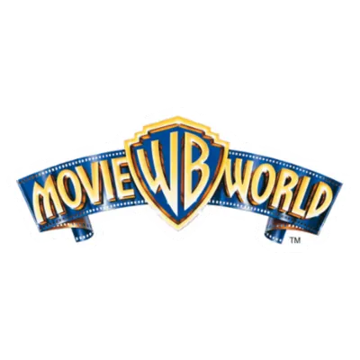 Warner Bros. Movie World logo featuring a stylised blue and gold shield with initials WB; text "MOVIE WORLD" arcs above and below the shield.