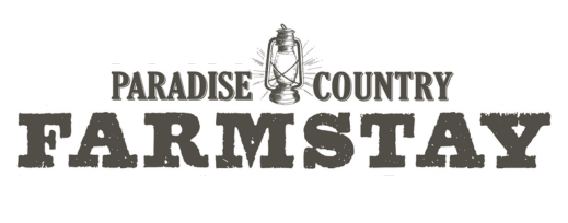 Paradise Country Farmstay logo with a lantern illustration between the words "Paradise" and "Country.