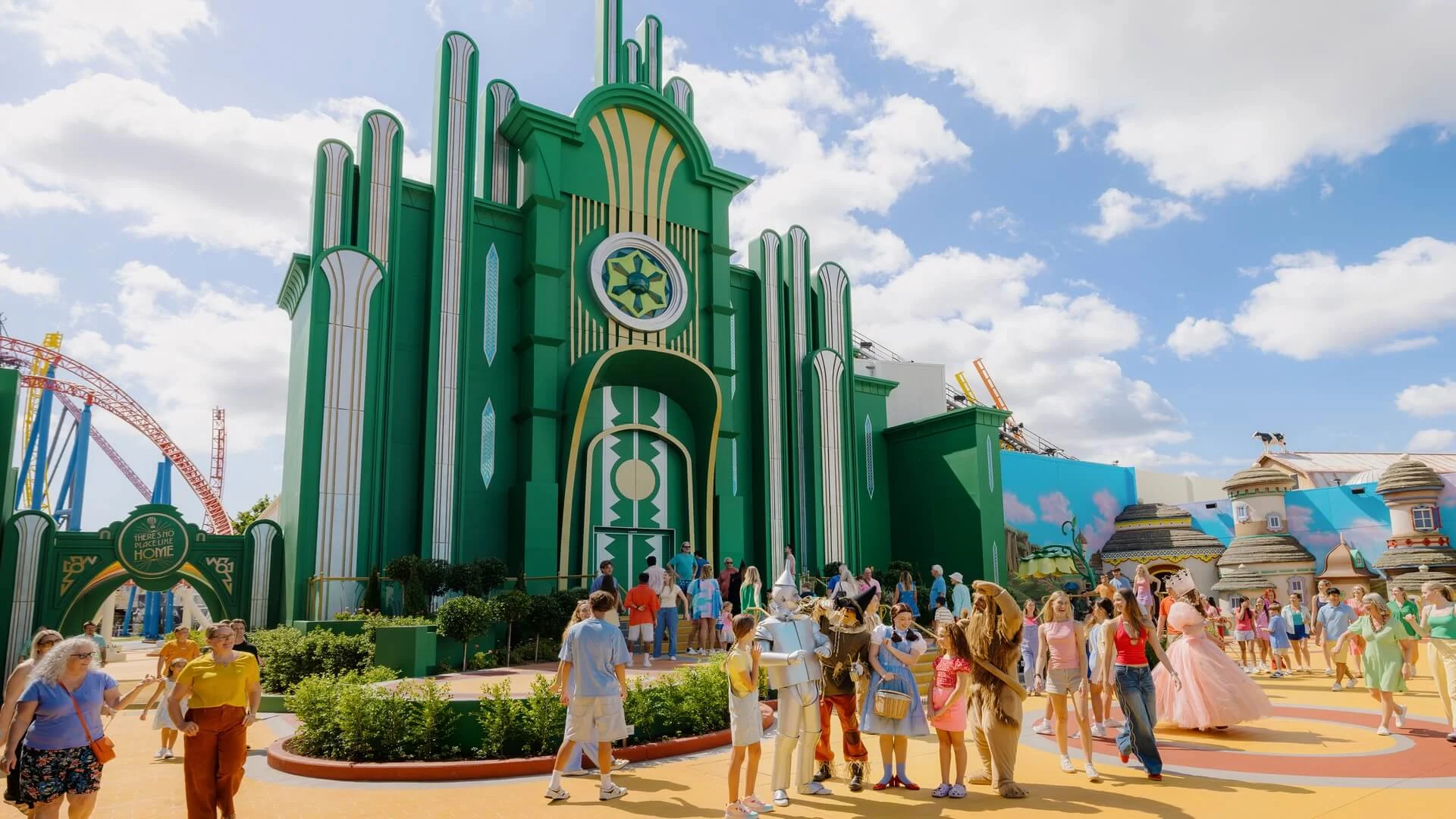 Visitors exploring the vibrant Emerald City precinct and Wizard of Oz characters at Warner Bros. Movie World Gold Coast.