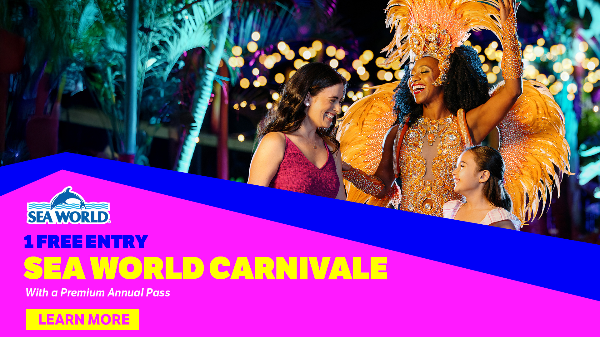 A smiling woman and young girl talk to a performer in a bright feathered costume at a colorful night event. Text promotes free entry to Sea World Carnivale with a Premium Annual Pass.