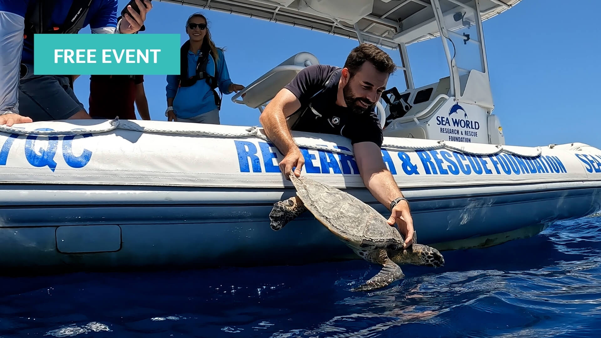 A man releases a sea turtle from a boat labeled "SEA WORLD RESEARCH &amp; RESCUE FOUNDATION" into the ocean, while several people look on. A "FREE EVENT" banner appears in the top left corner.