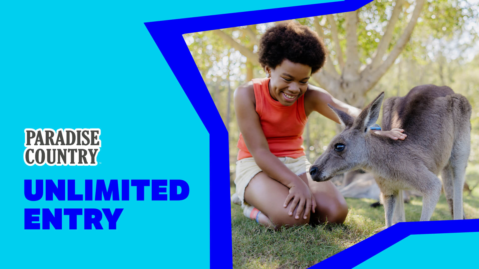 A child kneels on grass, smiling and petting a kangaroo. Beside them, text reads "Paradise Country Unlimited Entry" on a blue background. Trees are visible in the background.
