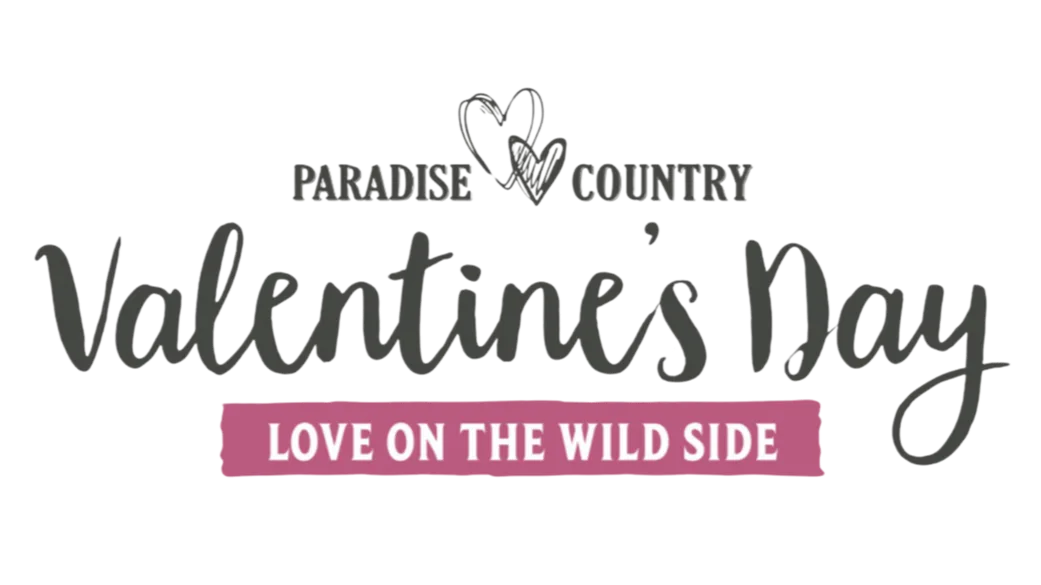 Paradise Country Valentine’s Day logo with two hearts and the slogan "Love on the Wild Side" on a pink banner.