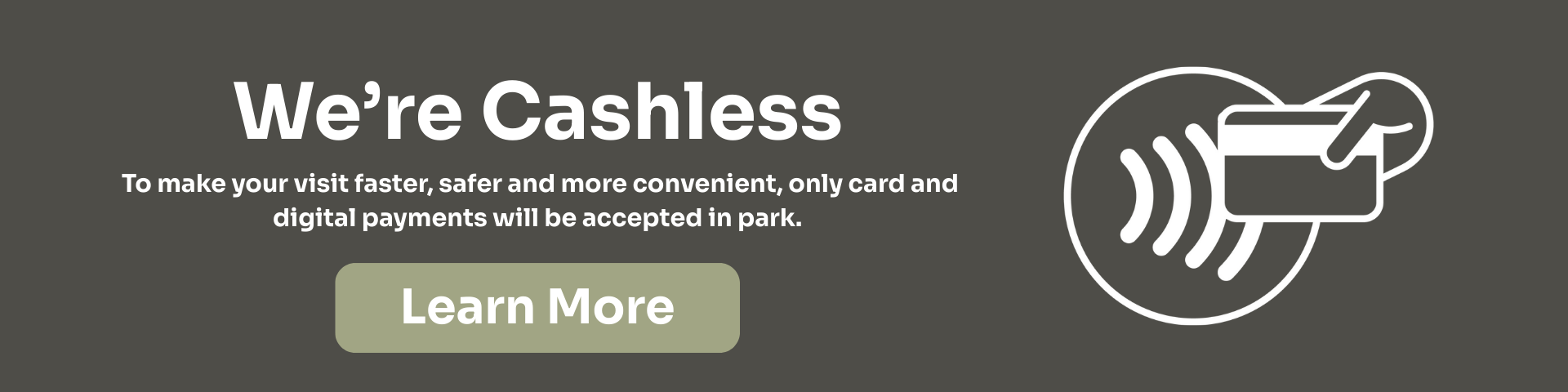 Banner stating "We're Cashless" with a message explaining only card and digital payments are accepted in the park. Includes a hand holding a card over a contactless symbol and a "Learn More" button.