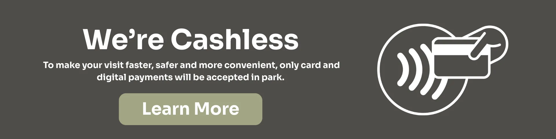 Banner stating "We're Cashless" with a message explaining only card and digital payments are accepted in the park. Includes a hand holding a card over a contactless symbol and a "Learn More" button.