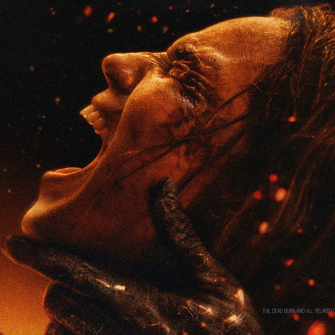 A person with a bloody face screams while being grabbed by the neck with a gloved hand. The background is dark with glowing embers floating around.