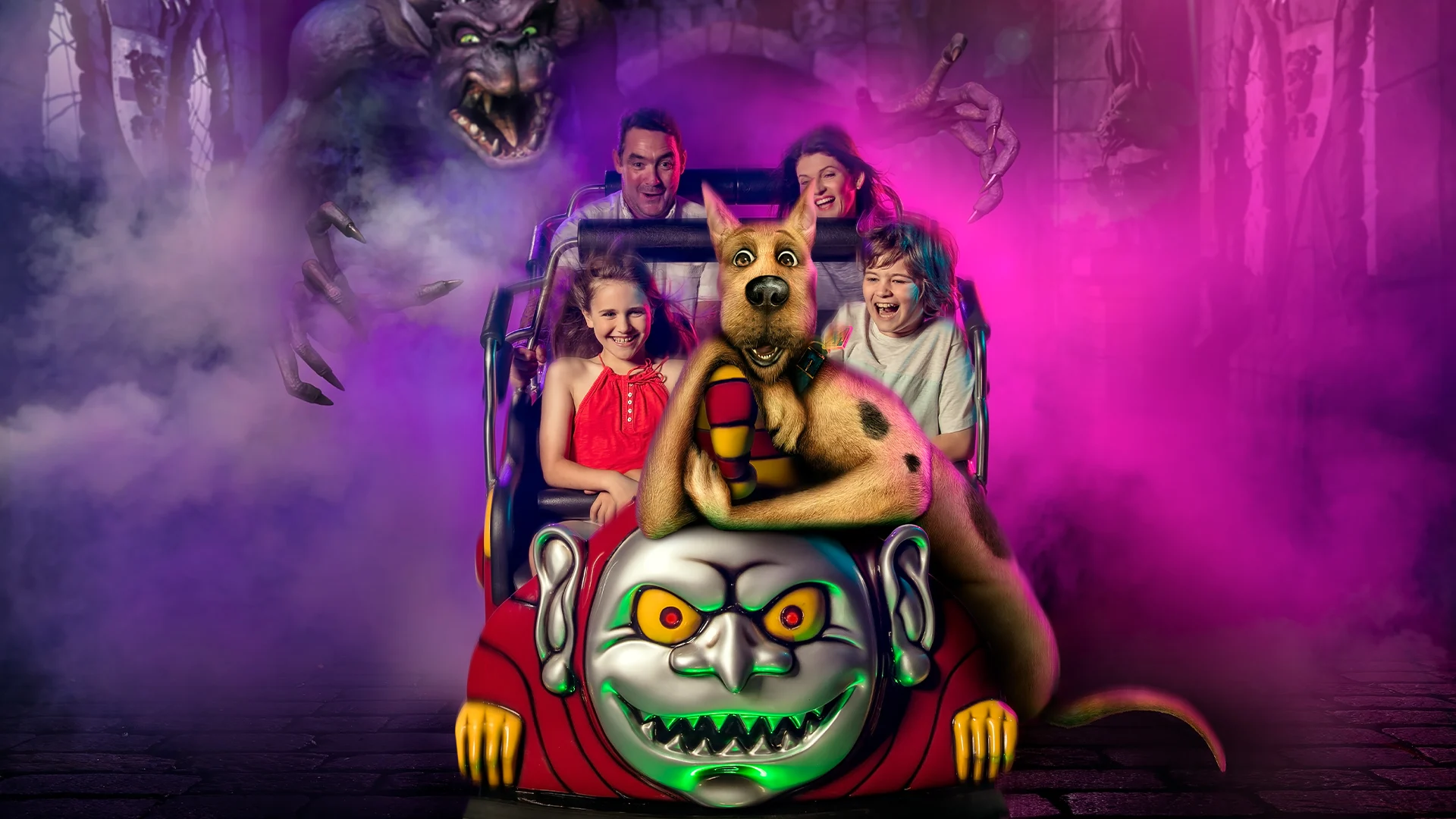 A family enjoying a spooky and thrilling ride on the Scooby-Doo Spooky Coaster at Warner Bros. Movie World